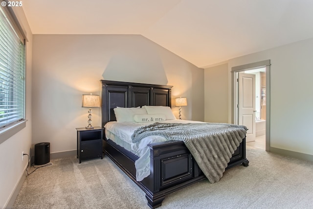 8326 SW Oak St, Portland, OR 97223 - bedroom with vaulted ceiling, light carpet, and ensuite bath
