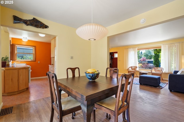 3116 SE 74th Ave, Portland, OR 97206 - dining space featuring wood finished floors and baseboards