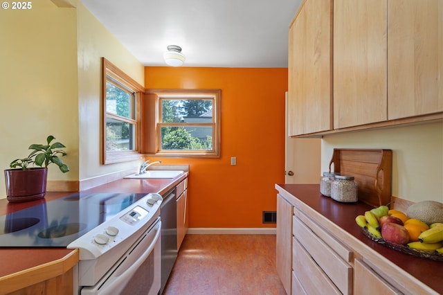 3116 SE 74th Ave, Portland, OR 97206 - kitchen featuring white electric range oven, dishwasher, and light brown cabinetry