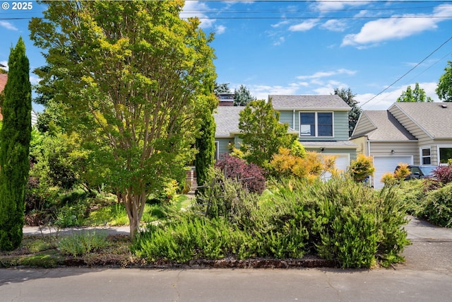 3116 SE 74th Ave, Portland, OR 97206 - view of property hidden behind natural elements featuring roof with shingles
