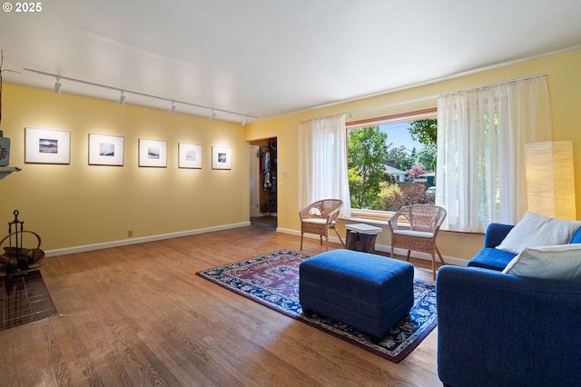 3116 SE 74th Ave, Portland, OR 97206 - living area featuring track lighting and wood finished floors