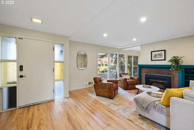 9080 SW Brier Ln, Portland, OR 97223 - living area with a fireplace, wood finished floors, recessed lighting, and baseboards