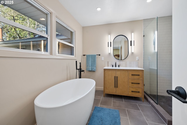 9080 SW Brier Ln, Portland, OR 97223 - bathroom featuring vanity, a shower stall, a freestanding tub, recessed lighting, and tile patterned floors