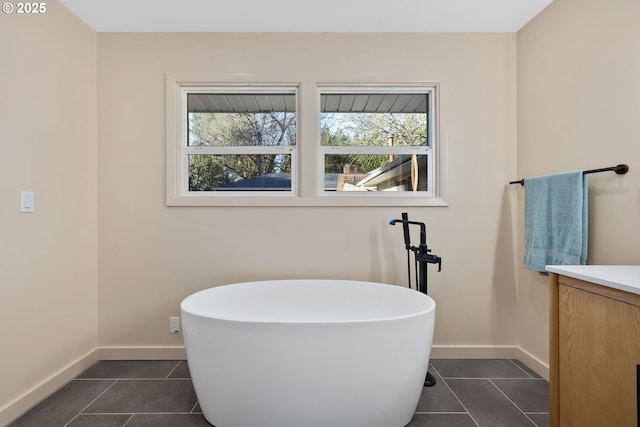 9080 SW Brier Ln, Portland, OR 97223 - full bathroom featuring a freestanding tub, plenty of natural light, vanity, and tile patterned floors