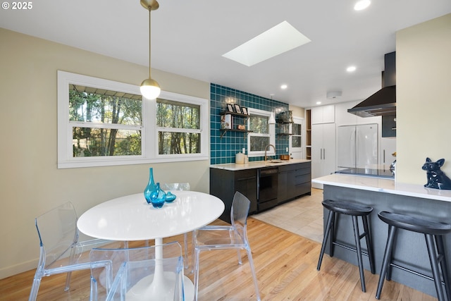 9080 SW Brier Ln, Portland, OR 97223 - dining area featuring a skylight, light wood finished floors, and recessed lighting