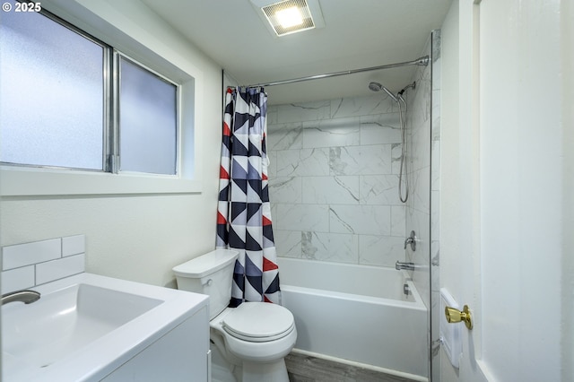 full bathroom featuring vanity, wood-type flooring, shower / tub combo, and toilet