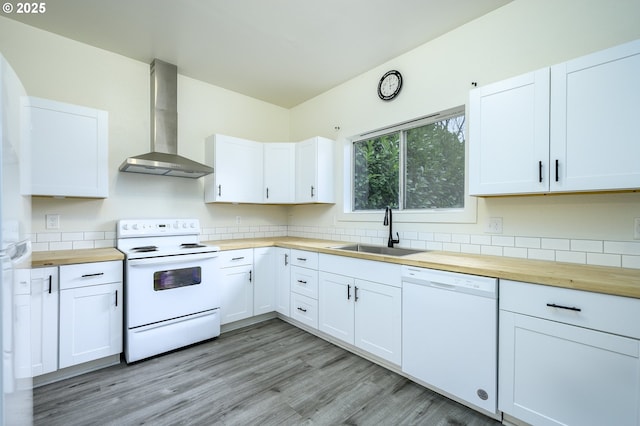 kitchen with white cabinets, wall chimney exhaust hood, and white appliances