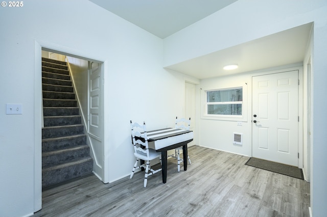 entrance foyer featuring hardwood / wood-style flooring and heating unit