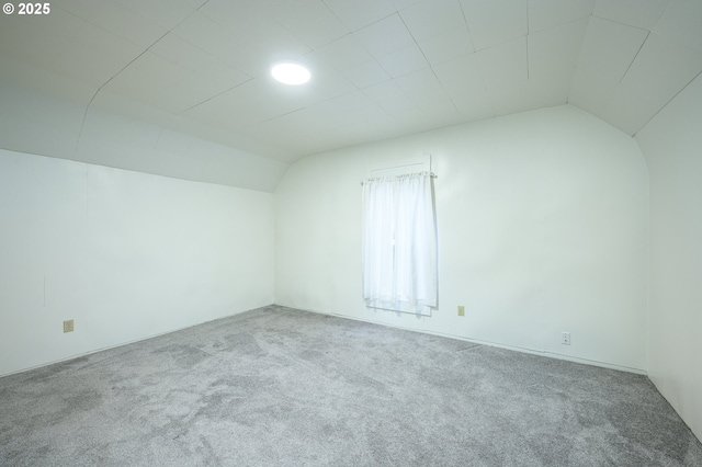 bonus room with carpet and vaulted ceiling