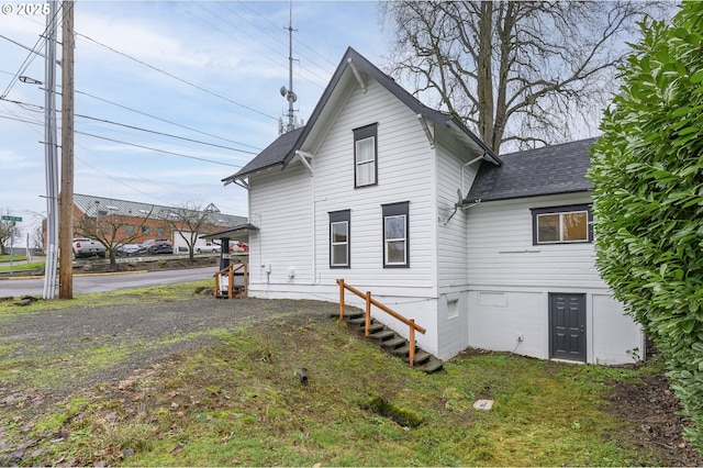 back of house with a yard