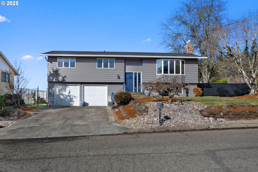 split foyer home featuring a garage