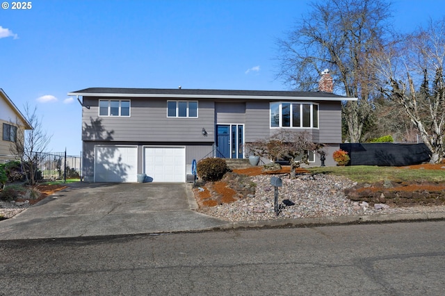 split foyer home featuring a garage