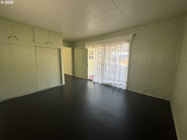 spare room with concrete floors