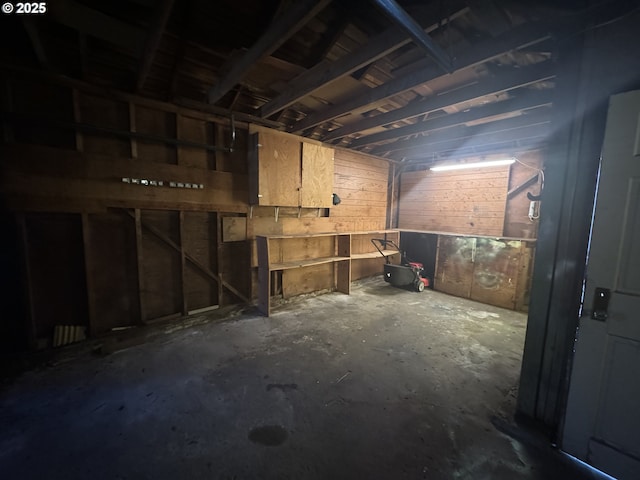 miscellaneous room featuring unfinished concrete flooring