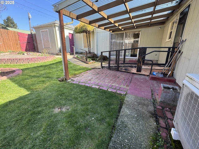 view of yard with ac unit, a storage shed, fence, a pergola, and an outdoor structure