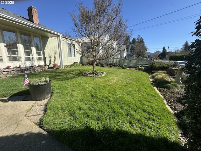 view of yard featuring fence