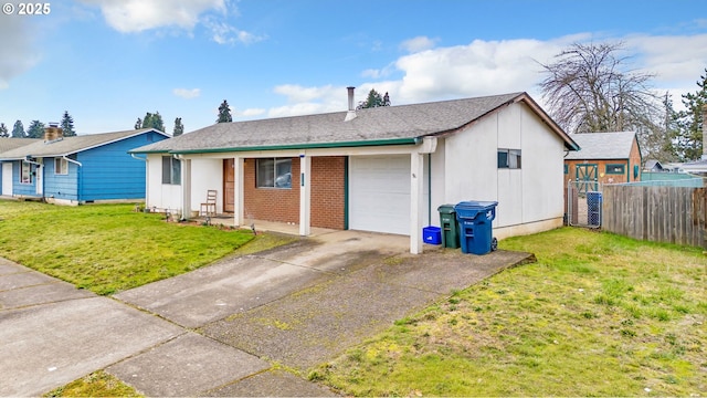 exterior space featuring a garage and a yard