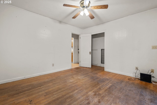 unfurnished bedroom featuring ceiling fan, baseboards, and wood-type flooring