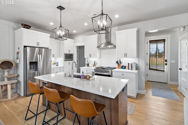 507 Honeysuckle Ln, Eugene, OR 97401 - kitchen featuring appliances with stainless steel finishes, a chandelier, a sink, a kitchen breakfast bar, and recessed lighting