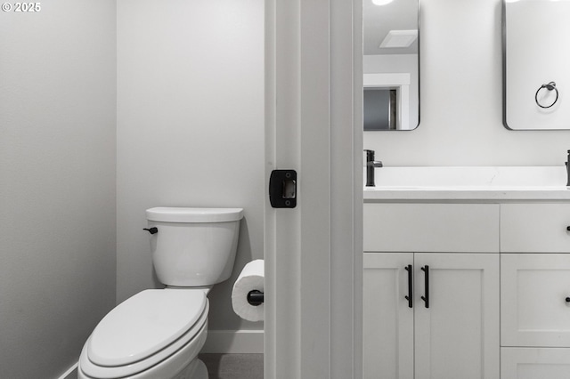 507 Honeysuckle Ln, Eugene, OR 97401 - bathroom featuring vanity, toilet, and baseboards