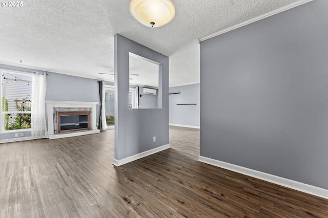 unfurnished living room featuring baseboards, a textured ceiling, crown molding, dark wood-type flooring, and a premium fireplace