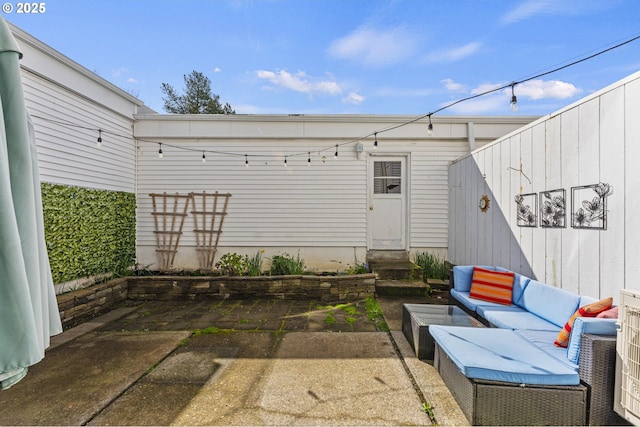 view of patio with an outdoor living space and entry steps