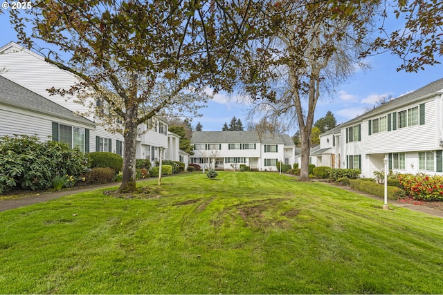 view of community with a residential view and a lawn