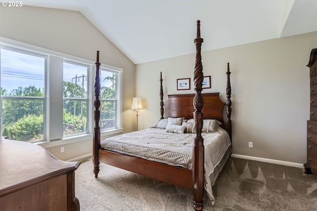 carpeted bedroom with vaulted ceiling and baseboards