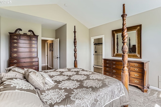 bedroom featuring carpet floors, lofted ceiling, ensuite bathroom, and baseboards
