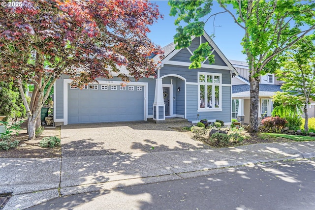 view of front of home with concrete driveway and a garage