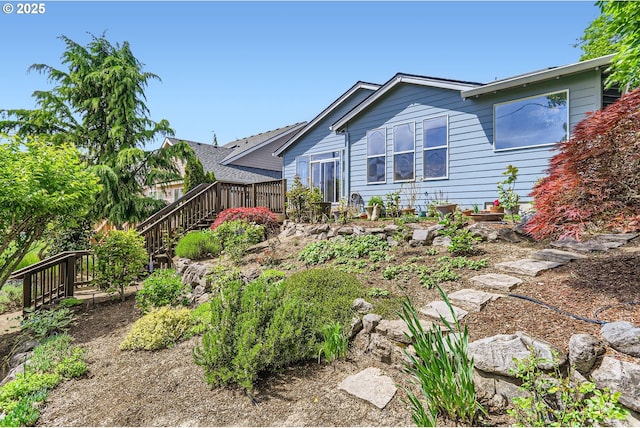 view of front of property with a deck and stairway