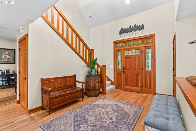 770 N Moss St, Lowell, OR 97452 - foyer featuring stairs, wood finished floors, and a towering ceiling