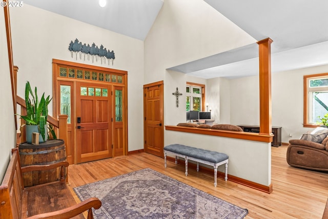 770 N Moss St, Lowell, OR 97452 - entryway featuring wood finished floors, ornate columns, and a towering ceiling