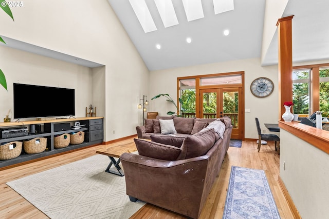 770 N Moss St, Lowell, OR 97452 - living room featuring high vaulted ceiling, french doors, a skylight, wood finished floors, and recessed lighting