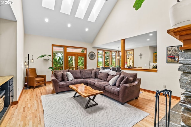770 N Moss St, Lowell, OR 97452 - living area with high vaulted ceiling, light wood-style flooring, a skylight, and recessed lighting