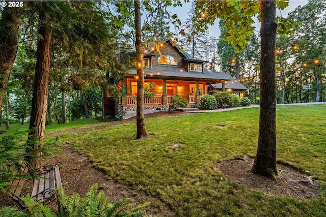 770 N Moss St, Lowell, OR 97452 - view of front of house with covered porch and a front yard