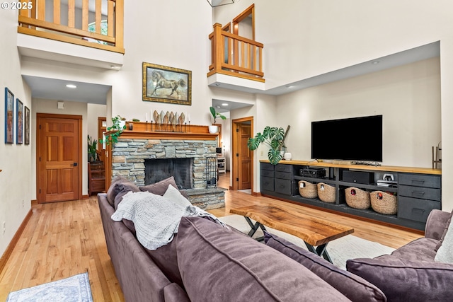 770 N Moss St, Lowell, OR 97452 - living room with wood finished floors, a towering ceiling, and a stone fireplace