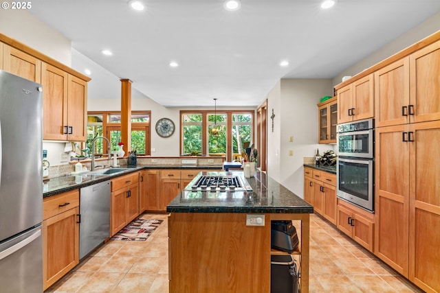 770 N Moss St, Lowell, OR 97452 - kitchen featuring stainless steel appliances, a peninsula, recessed lighting, light tile patterned floors, and glass insert cabinets