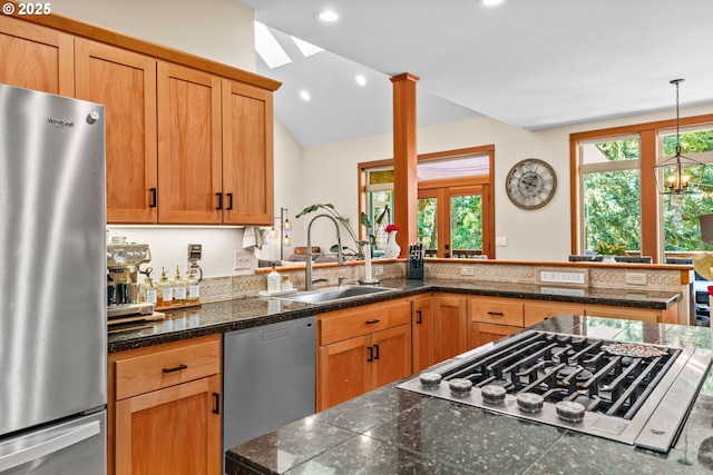 770 N Moss St, Lowell, OR 97452 - kitchen featuring stainless steel appliances, tile counters, lofted ceiling, a peninsula, and decorative light fixtures