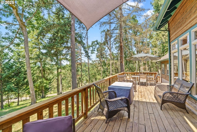 770 N Moss St, Lowell, OR 97452 - deck featuring outdoor dining area and view of wooded area