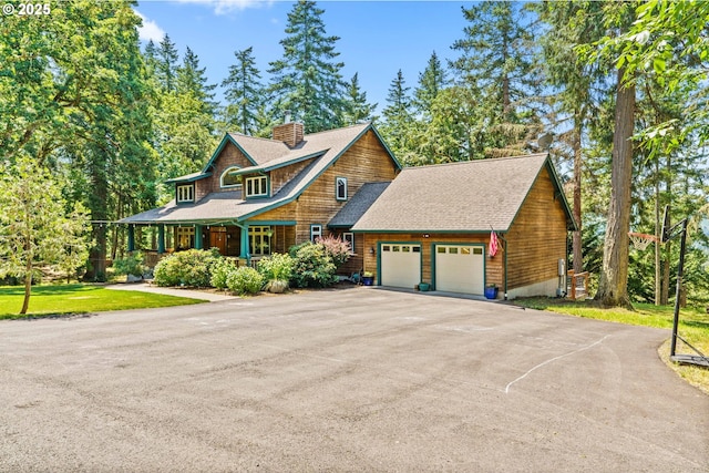 770 N Moss St, Lowell, OR 97452 - shingle-style home with an attached garage, a chimney, driveway, a porch, and roof with shingles