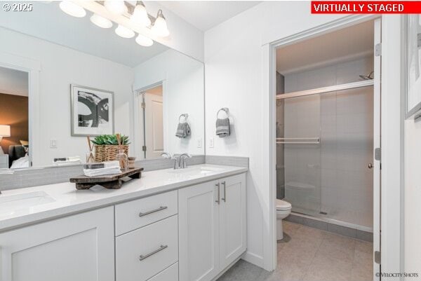 2747 Woodfern Ter Lot 57, Eugene, OR 97403 - bathroom with double vanity, a shower stall, tile patterned floors, and ensuite bathroom
