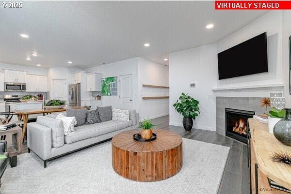 2747 Woodfern Ter Lot 57, Eugene, OR 97403 - living area featuring a tile fireplace, recessed lighting, and light wood-type flooring
