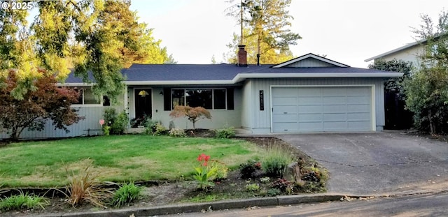 ranch-style house with an attached garage, a chimney, driveway, and a front yard