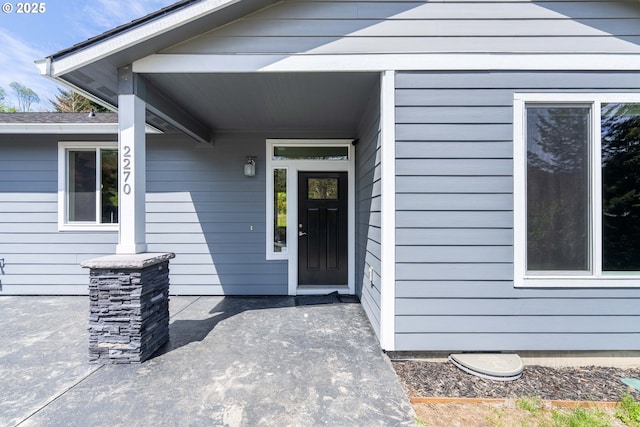 doorway to property featuring a patio area