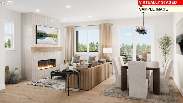 6496 NW Olympic Ln Unit L 25, Camas, WA 98607 - living area featuring a fireplace, wood finished floors, plenty of natural light, and recessed lighting