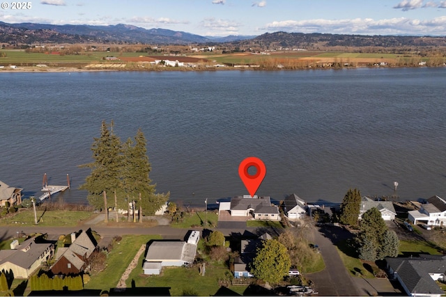 aerial view featuring a residential view and a water and mountain view