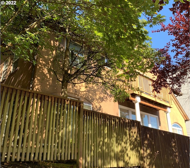 back of house with a balcony