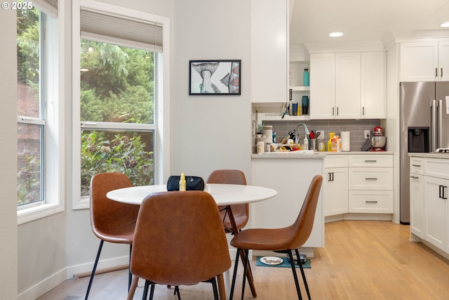 8326 SW 64th Ave, Portland, OR 97219 - dining space featuring plenty of natural light, light wood-style floors, and recessed lighting