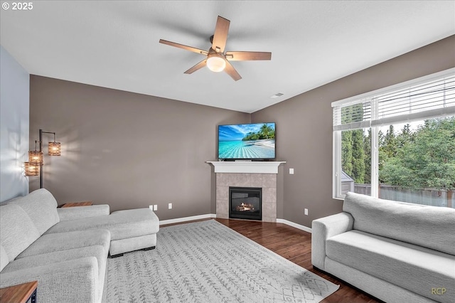 51568 SW S Fork Loop, Scappoose, OR 97056 - living room featuring a ceiling fan, wood finished floors, baseboards, and a fireplace